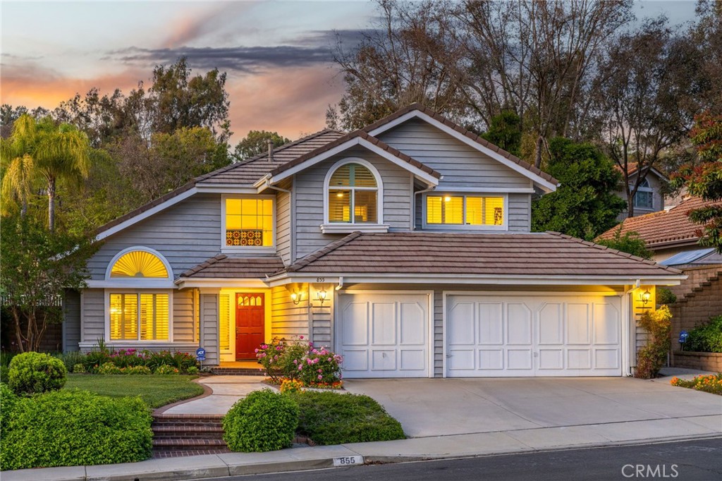 855 Ave Bernardo San Dimas, CA 91773 - Photo 4 of 65 a front view of a house with a yard and potted plants