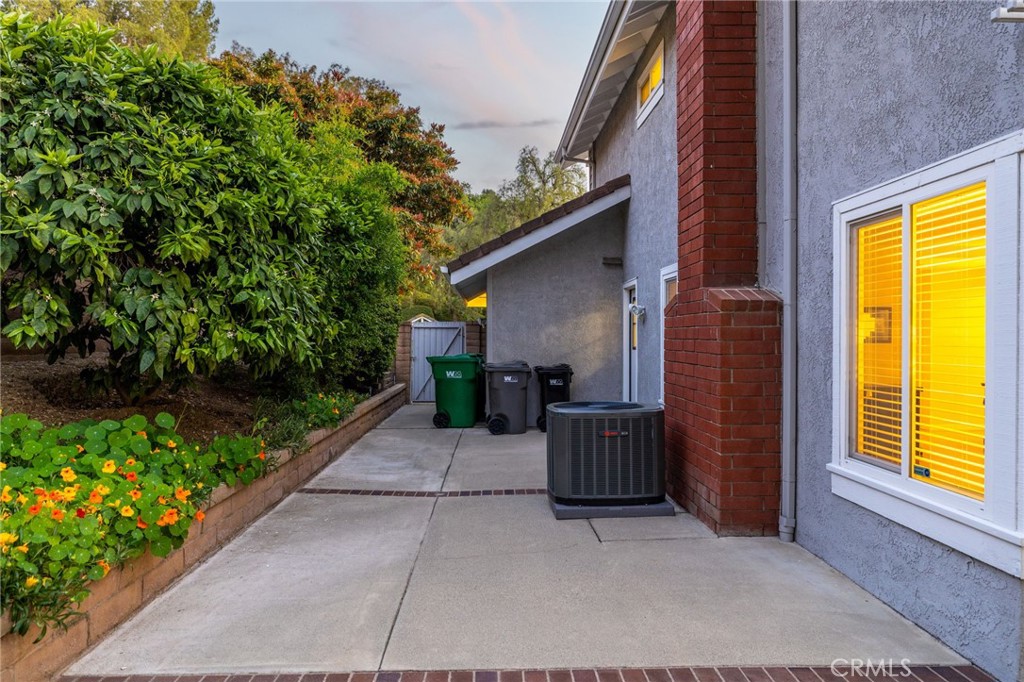 855 Ave Bernardo San Dimas, CA 91773 - Photo 55 of 65 a view of backyard with a chair and potted plants
