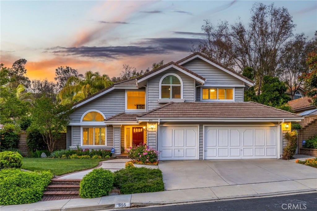 855 Ave Bernardo San Dimas, CA 91773 - Photo 62 of 65 a front view of a house with a yard and garage
