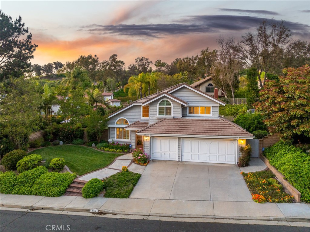 855 Ave Bernardo San Dimas, CA 91773 - Photo 64 of 65 a front view of a house with a yard and garage