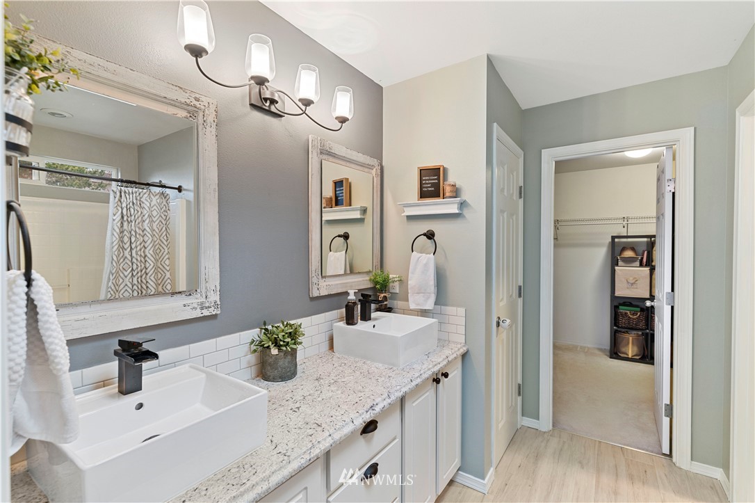 5042 Northeast 4th Place Renton, WA 98059 - Photo 15 of 29 a bathroom with a sink double vanity and a mirror