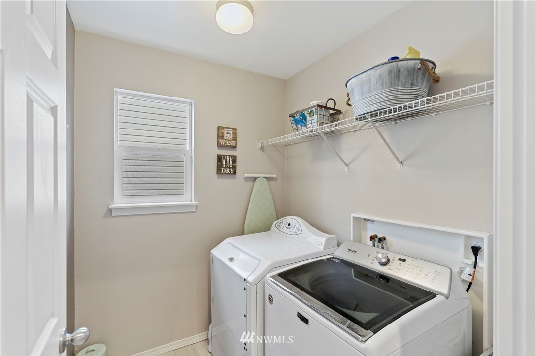 5042 Northeast 4th Place Renton, WA 98059 - Photo 20 of 29 a utility room with dryer and washer
