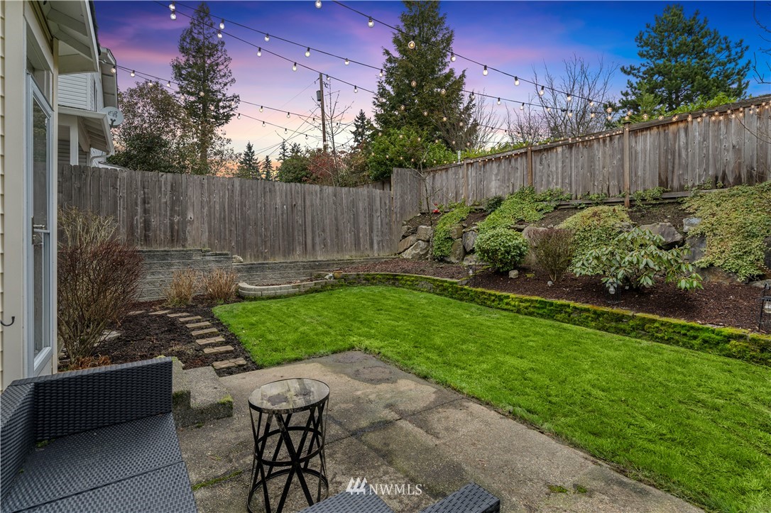 5042 Northeast 4th Place Renton, WA 98059 - Photo 22 of 29 a view of a backyard with plants and bench