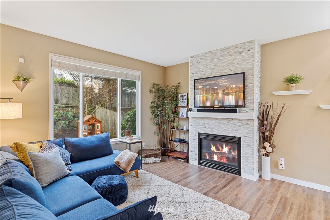 5042 Northeast 4th Place Renton, WA 98059 - Photo 4 of 29 a living room with furniture and a fireplace