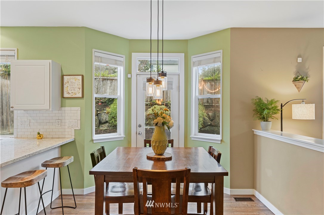 5042 Northeast 4th Place Renton, WA 98059 - Photo 7 of 29 a view of a dining room with furniture and window