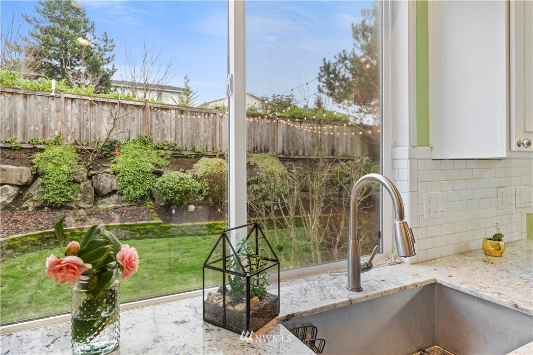 5042 Northeast 4th Place Renton, WA 98059 - Photo 10 of 29 a sink with a garden in the background