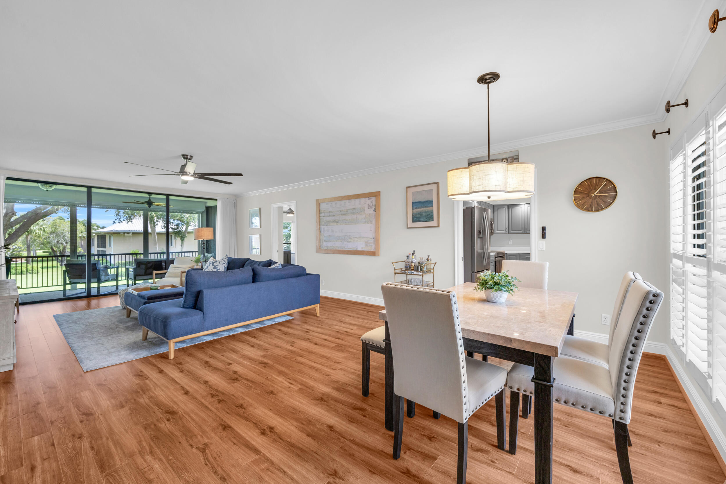 8 Southeast Turtle Creek Drive, Unit D Jupiter, FL 33469 - Photo 2 of 33 a living room with furniture and a floor to ceiling window