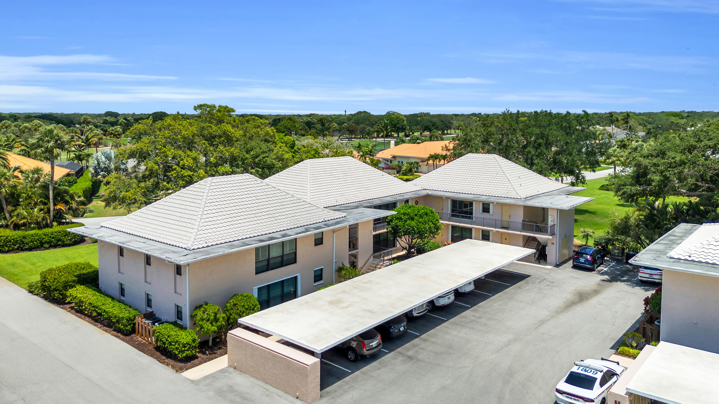 8 Southeast Turtle Creek Drive, Unit D Jupiter, FL 33469 - Photo 28 of 33 a view of a house with a patio