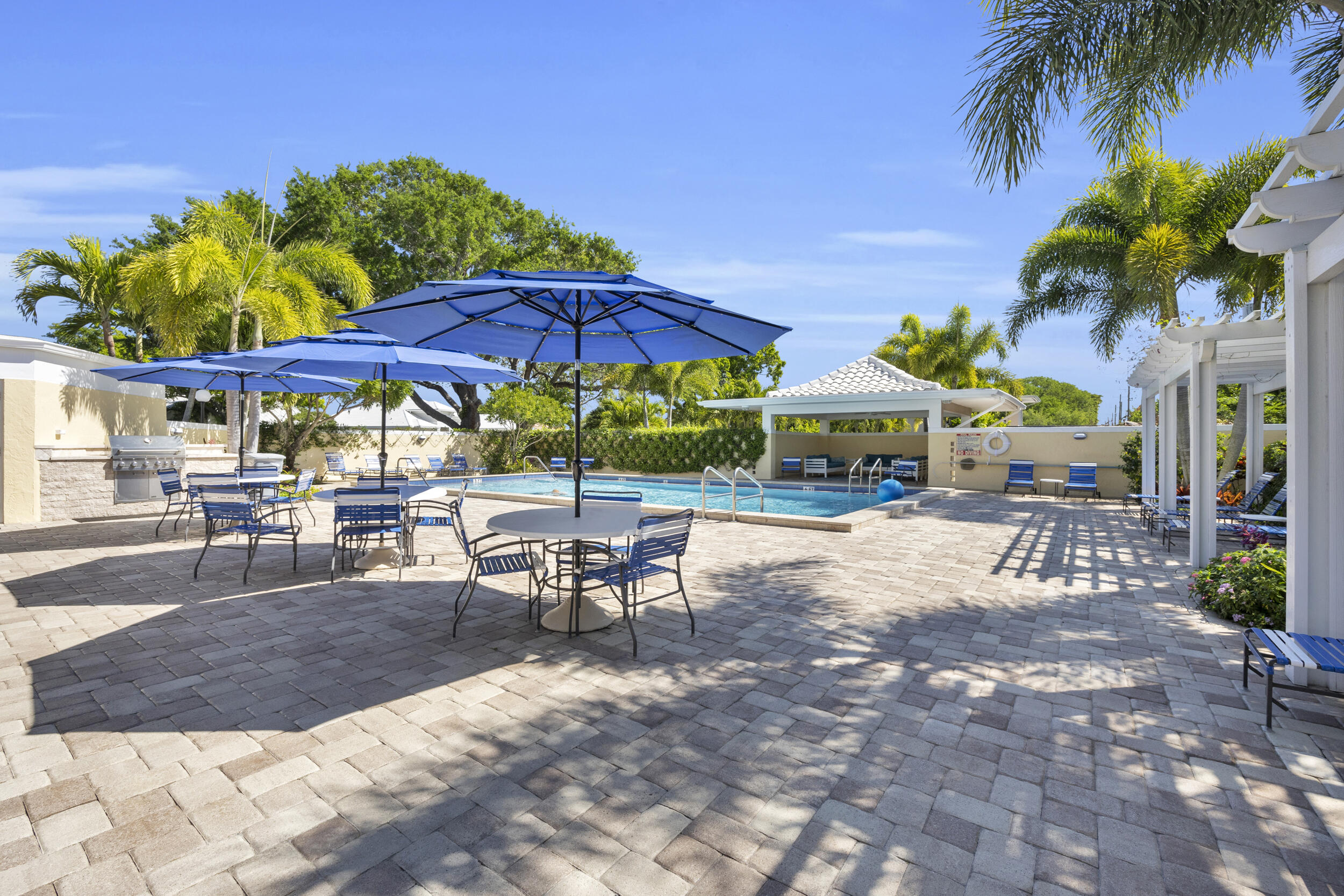 8 Southeast Turtle Creek Drive, Unit D Jupiter, FL 33469 - Photo 29 of 33 a view of outdoor space yard and patio