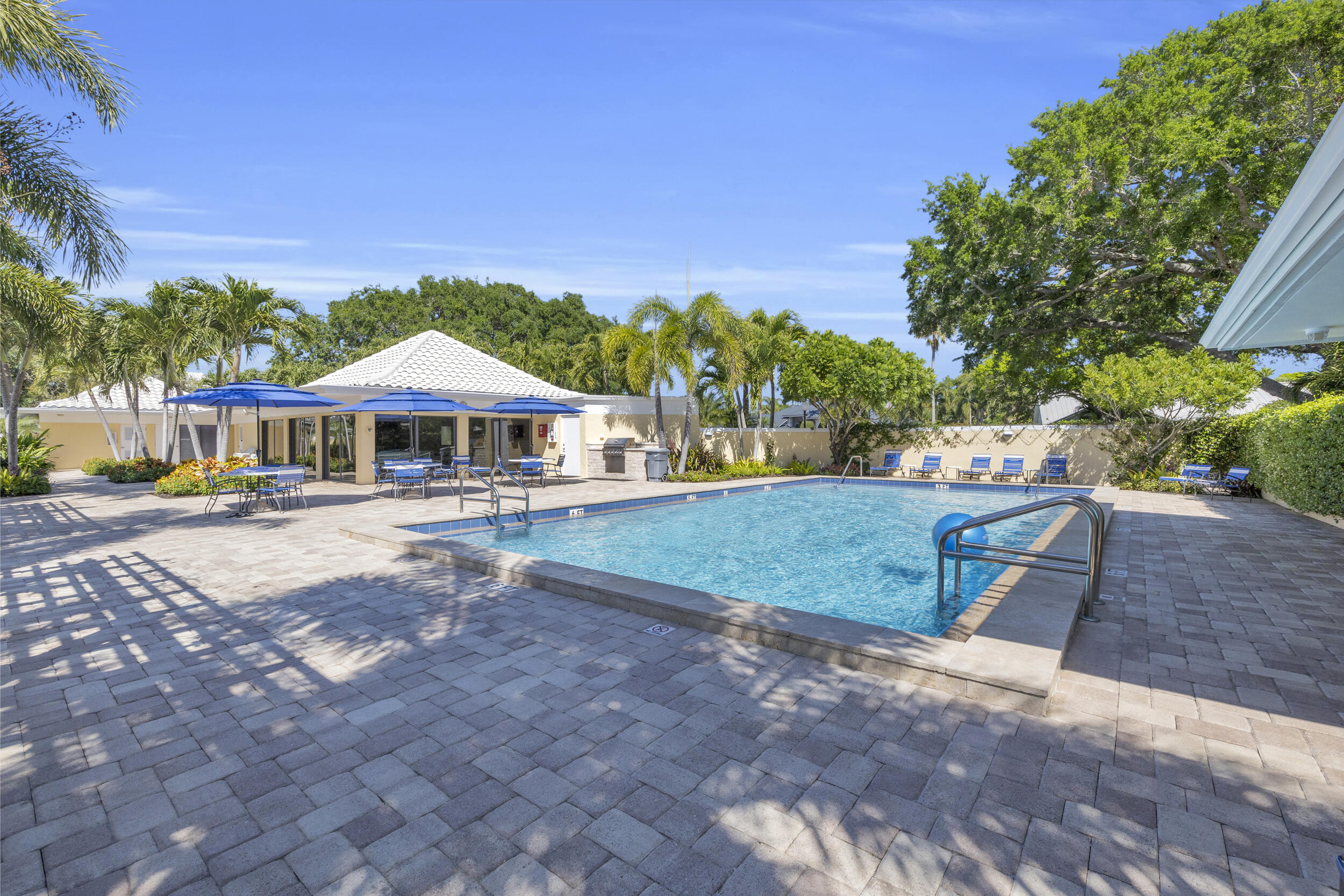 8 Southeast Turtle Creek Drive, Unit D Jupiter, FL 33469 - Photo 30 of 33 a view of a house with a yard
