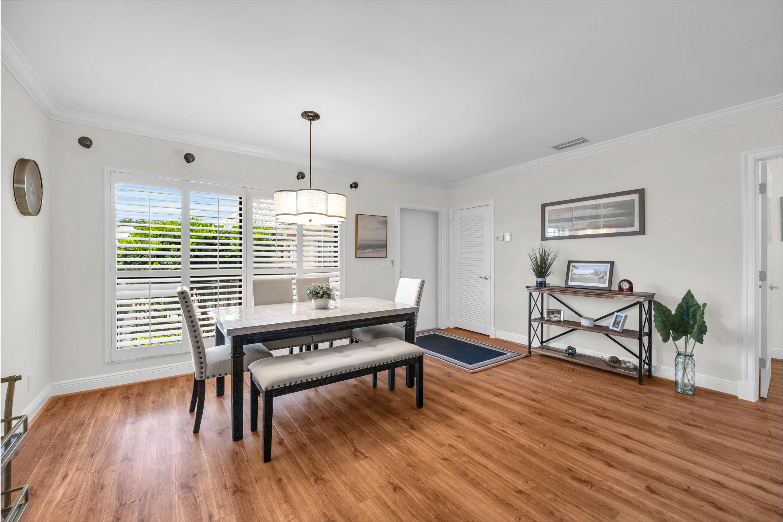 8 Southeast Turtle Creek Drive, Unit D Jupiter, FL 33469 - Photo 4 of 33 a living room with furniture and a wooden floor