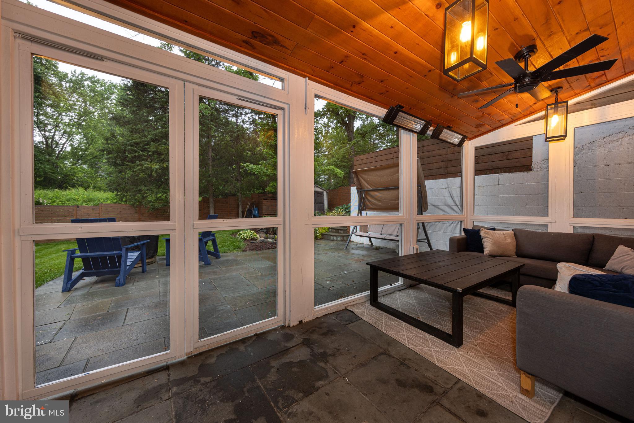 Fabulous screened-in porch with heaters & a 60" TV