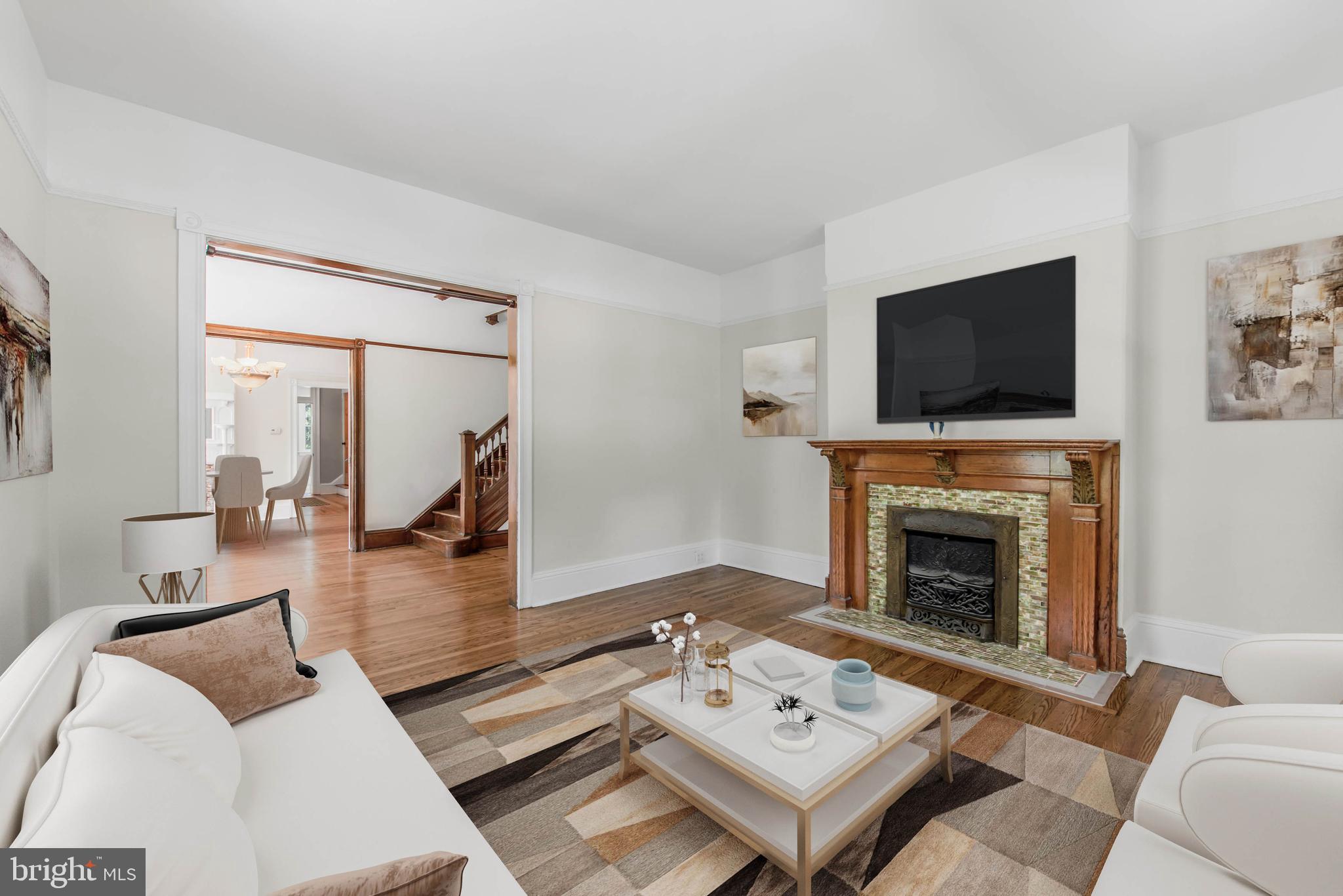 14 Simpson Road Ardmore, PA 19003 - Photo 11 of 58 a living room with furniture a fireplace and a flat screen tv
