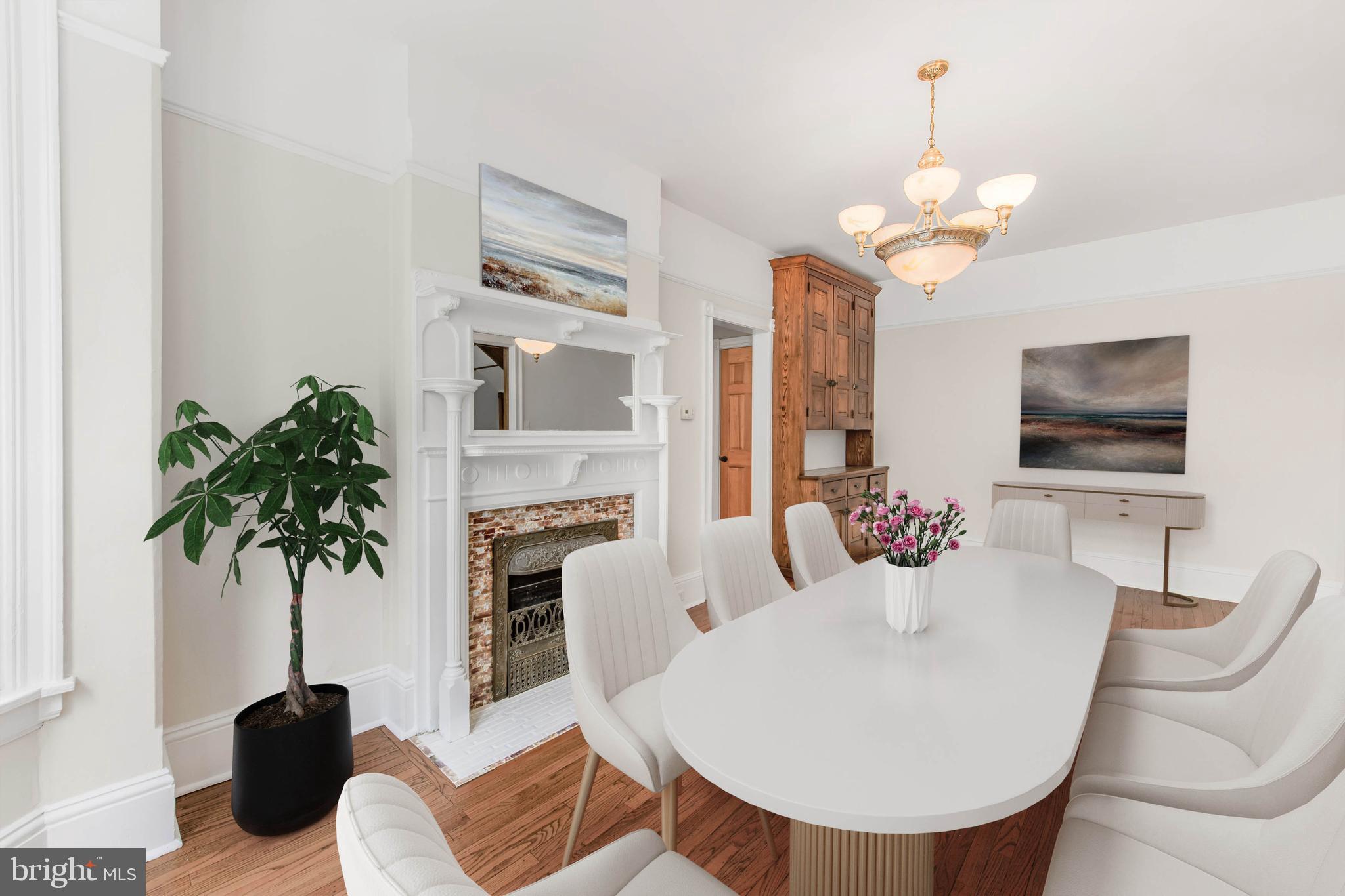 14 Simpson Road Ardmore, PA 19003 - Photo 18 of 58 a living room with furniture a chandelier and a flat screen tv