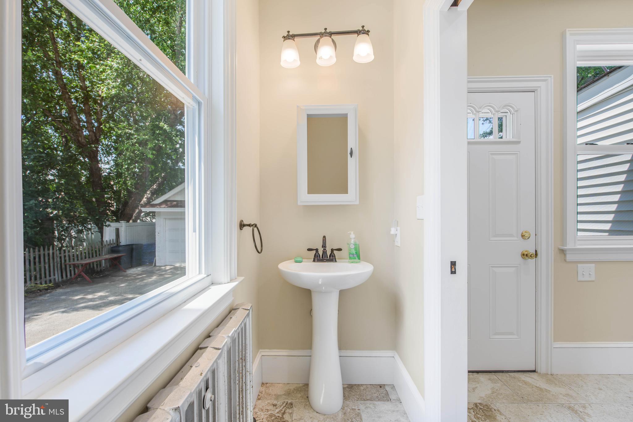 14 Simpson Road Ardmore, PA 19003 - Photo 27 of 58 a bathroom with a sink and a mirror
