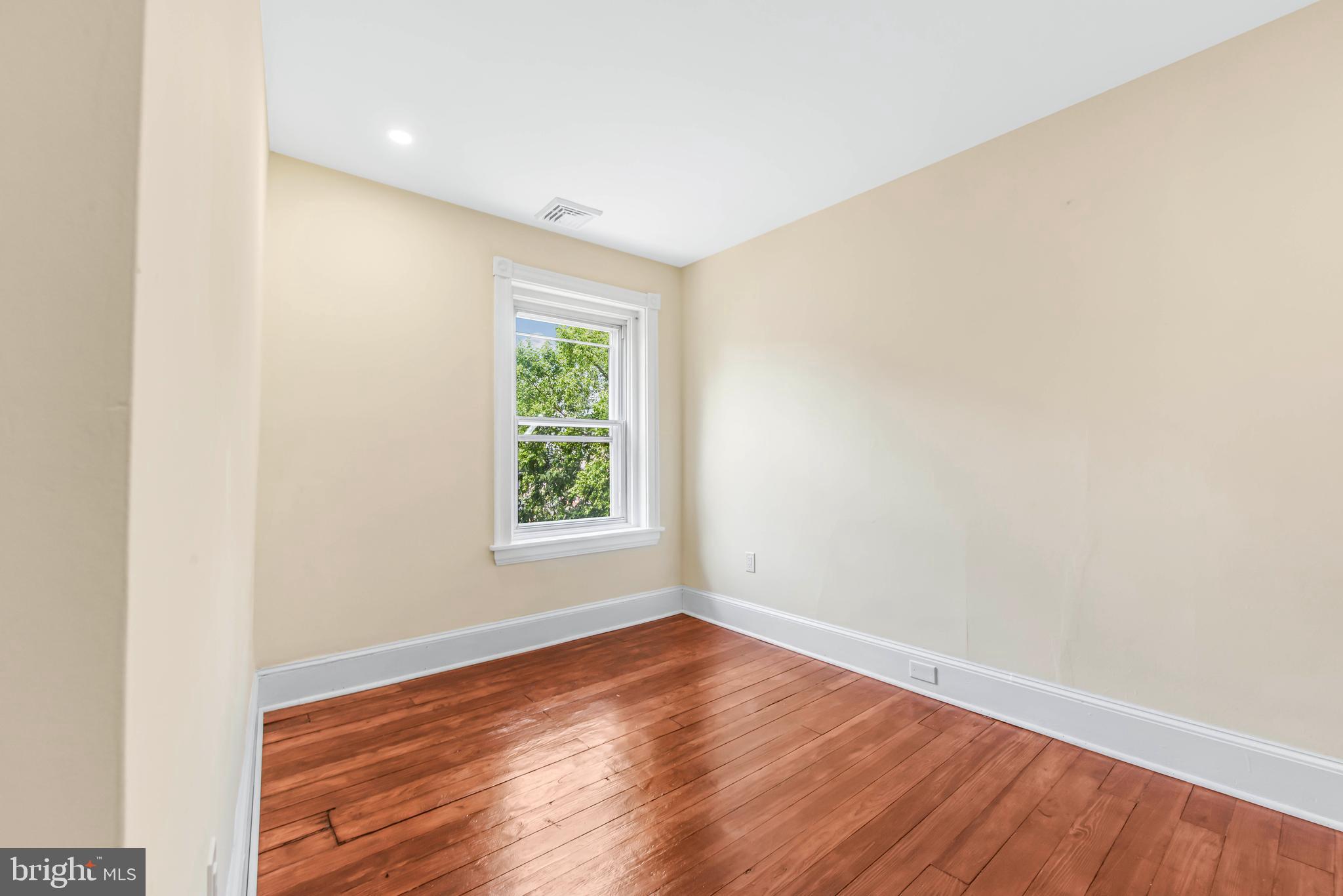 14 Simpson Road Ardmore, PA 19003 - Photo 36 of 58 an empty room with wooden floor and windows
