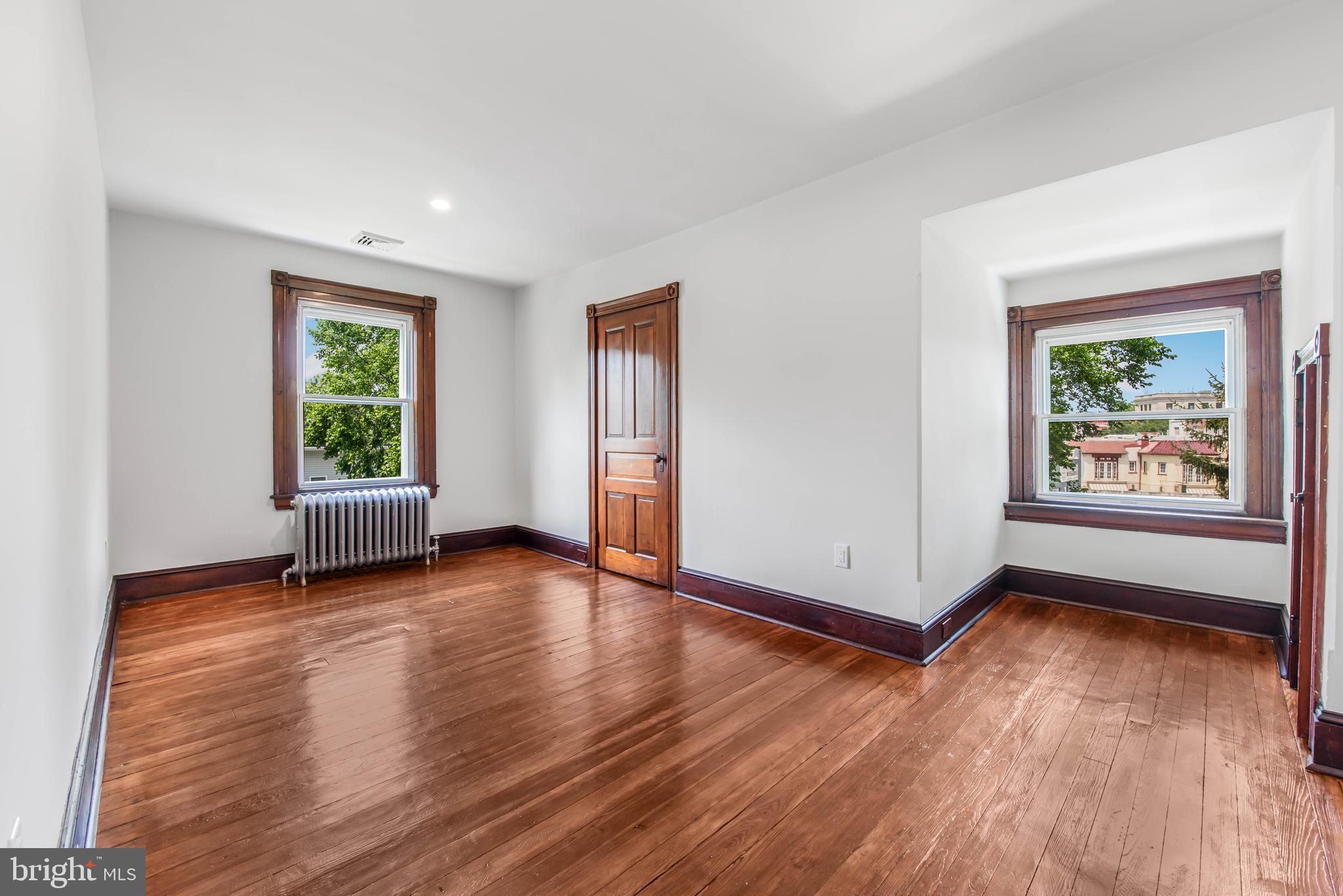 14 Simpson Road Ardmore, PA 19003 - Photo 39 of 58 a view of an empty room with wooden floor and a window