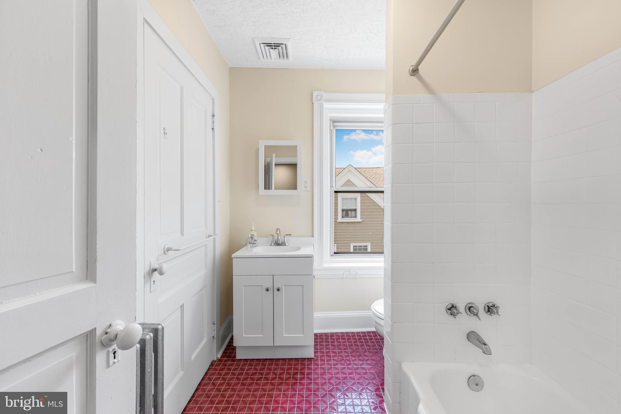 14 Simpson Road Ardmore, PA 19003 - Photo 41 of 58 a bathroom with a bathtub sink and mirror