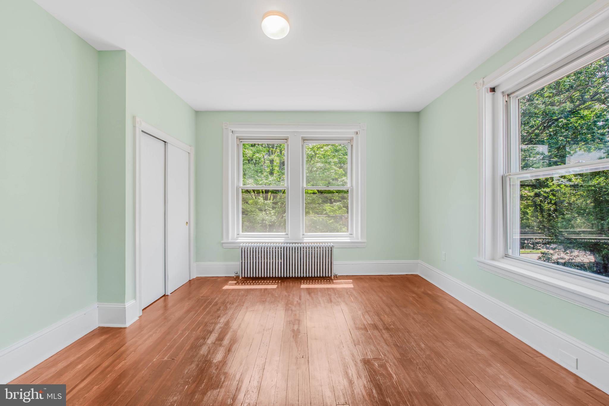 14 Simpson Road Ardmore, PA 19003 - Photo 42 of 58 an empty room with wooden floor and windows