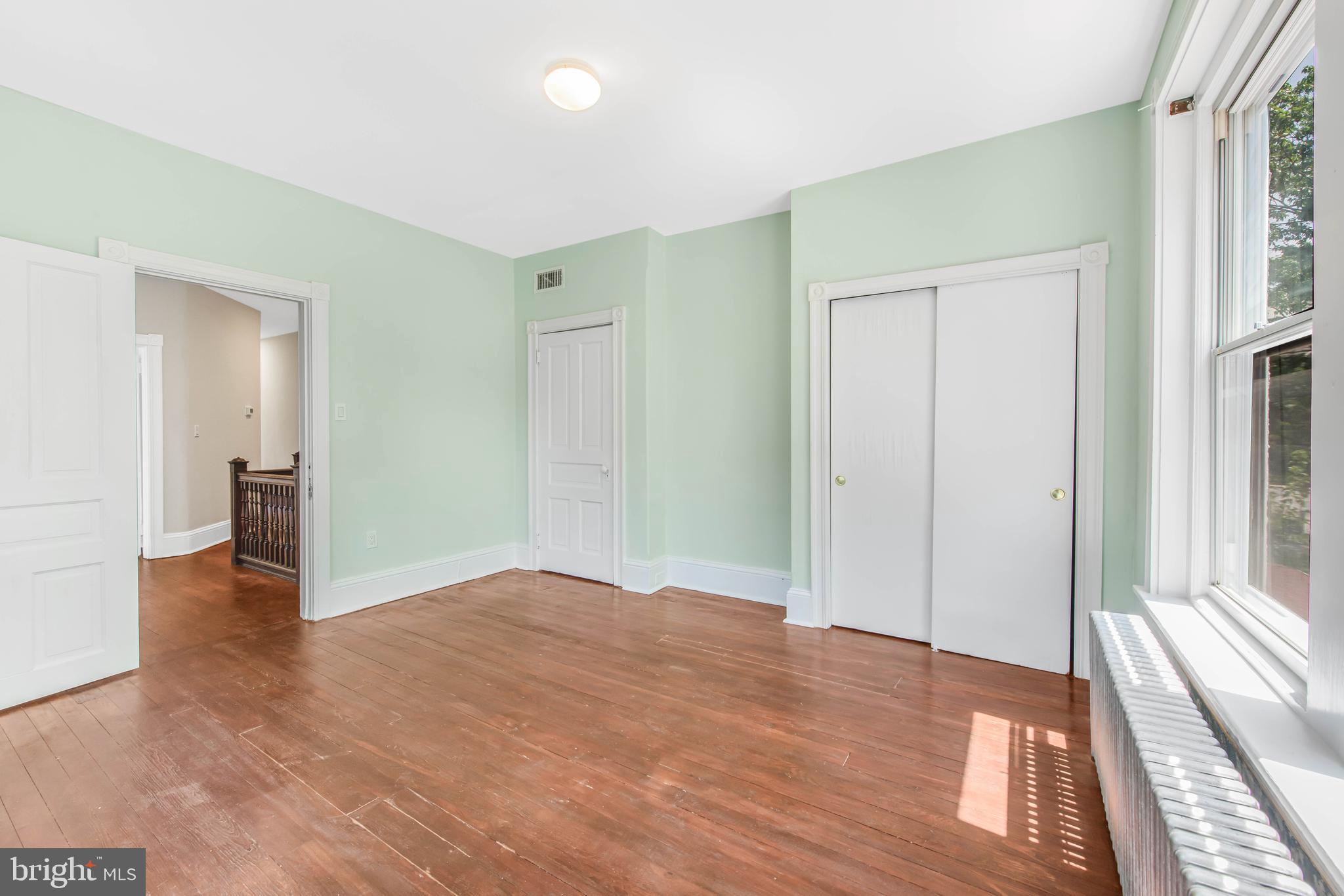 14 Simpson Road Ardmore, PA 19003 - Photo 43 of 58 a view of hallway with a large window and wooden floor
