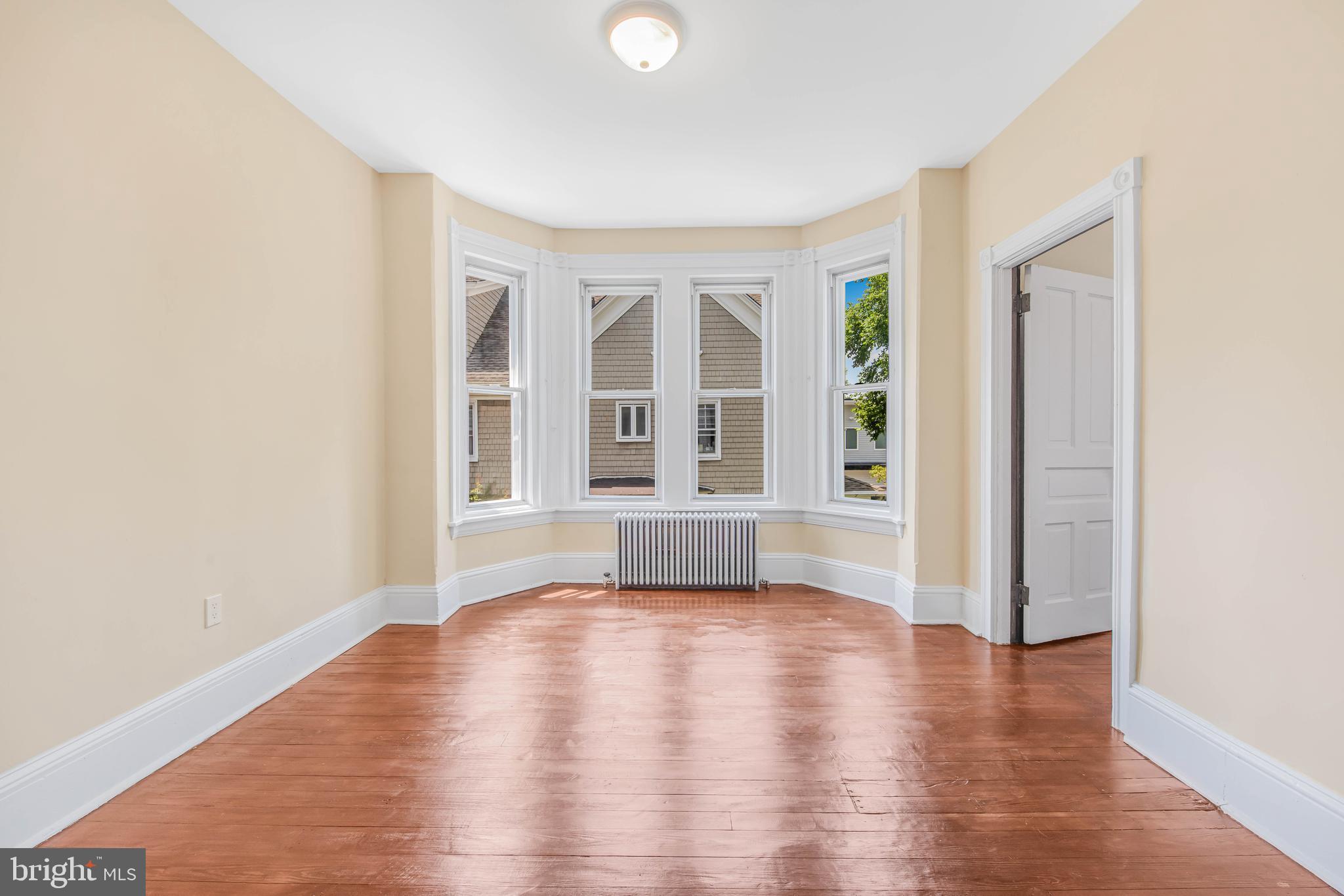 14 Simpson Road Ardmore, PA 19003 - Photo 44 of 58 an empty room with wooden floor and windows