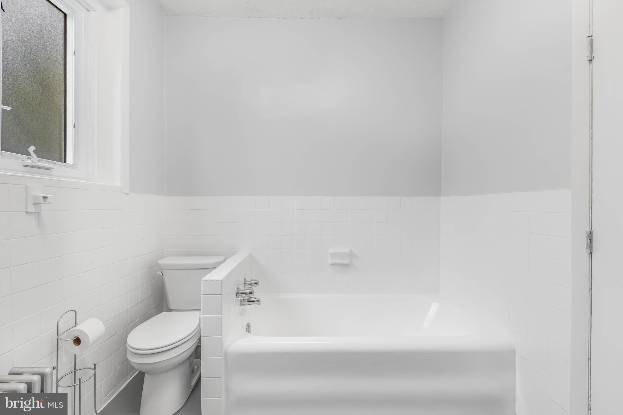 14 Simpson Road Ardmore, PA 19003 - Photo 48 of 58 a bathroom with a toilet and a bathtub