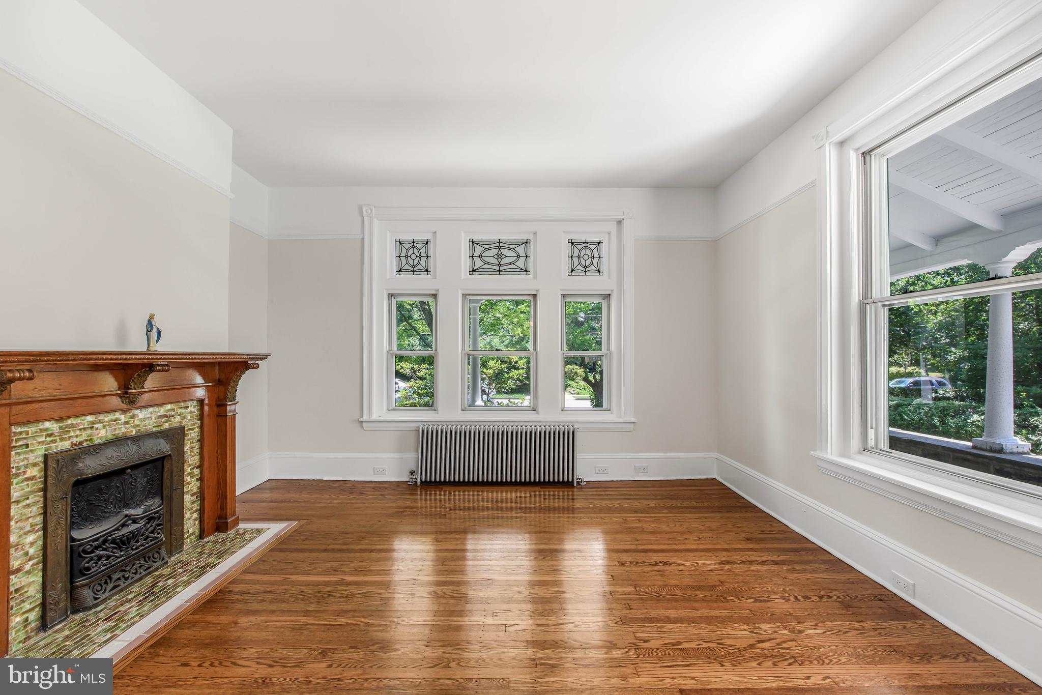 14 Simpson Road Ardmore, PA 19003 - Photo 7 of 58 wooden floor fireplace and windows in an empty room