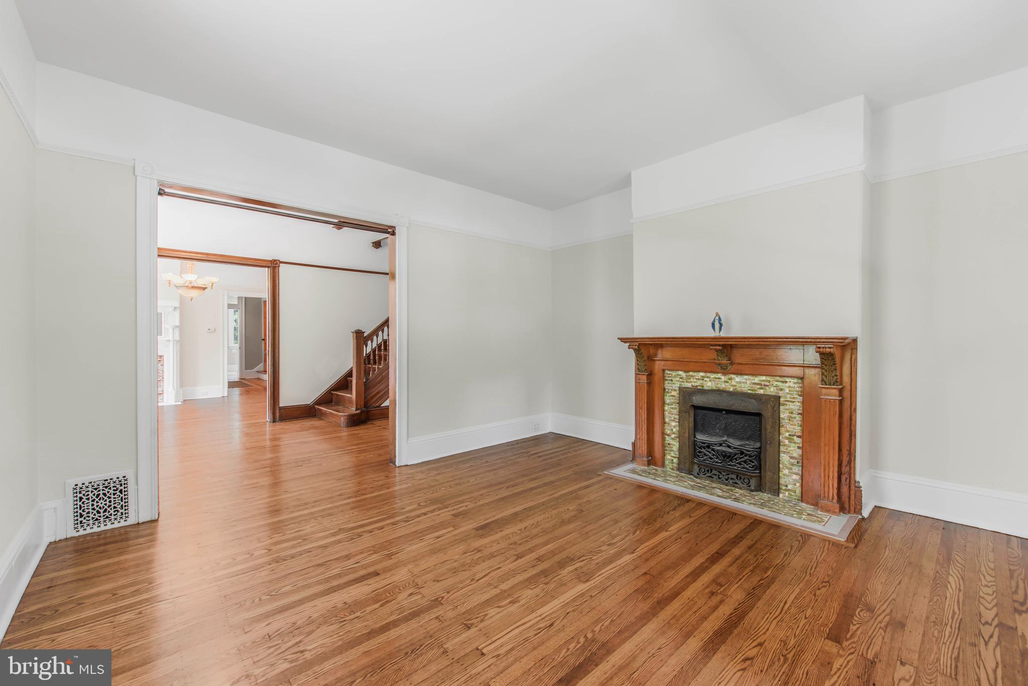 14 Simpson Road Ardmore, PA 19003 - Photo 8 of 58 a view of empty room with wooden floor and fireplace