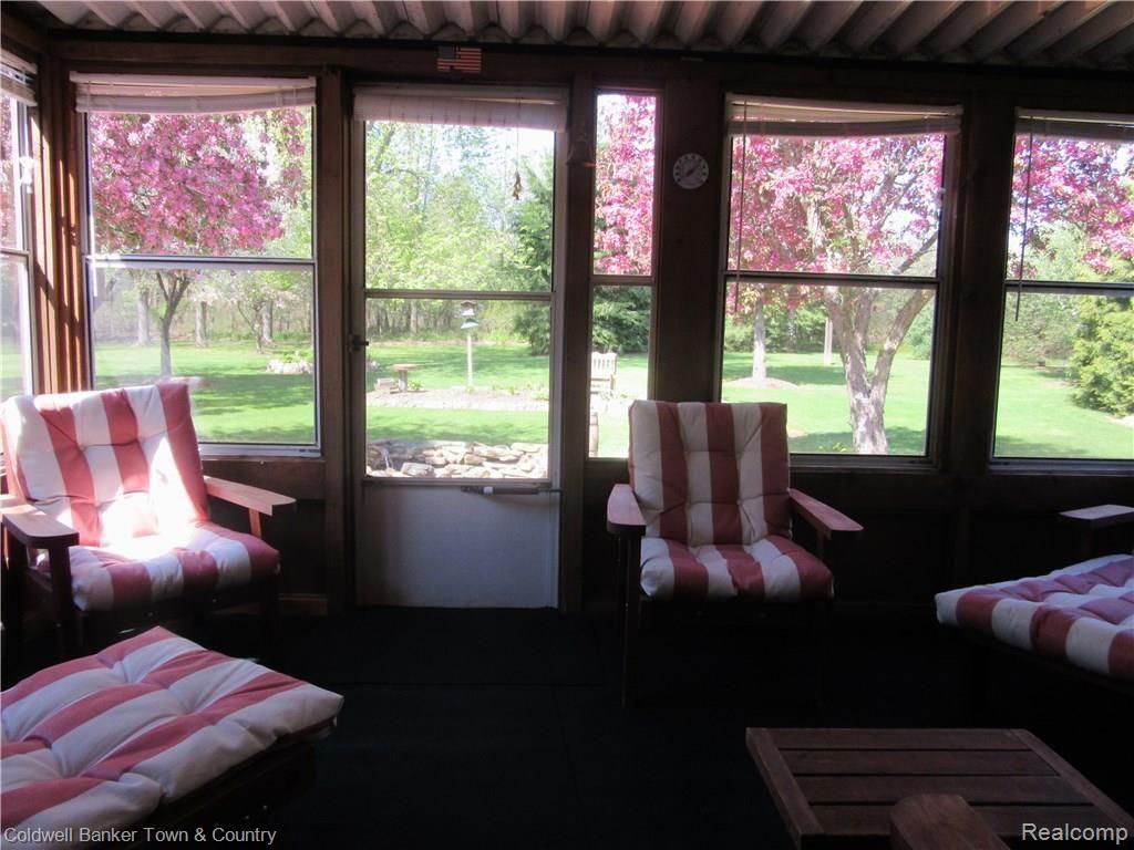 3758 Beattie Road Howell, MI 48843 - Photo 10 of 62 walking into 3 season room from dining room