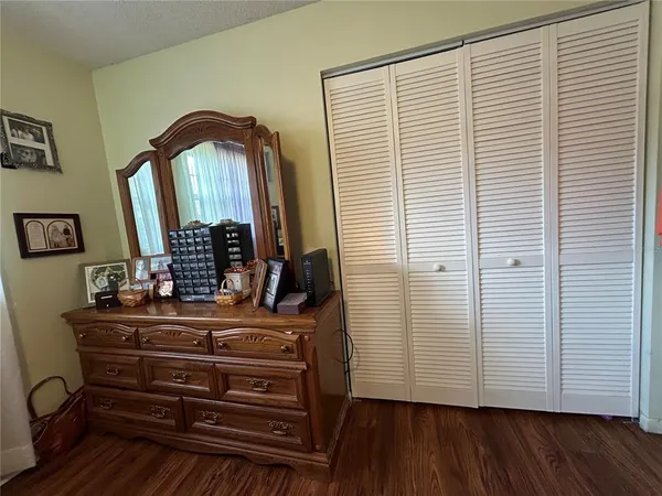a view of room with wooden floor