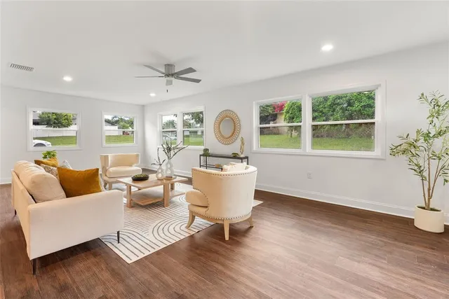 a living room with furniture and a large window