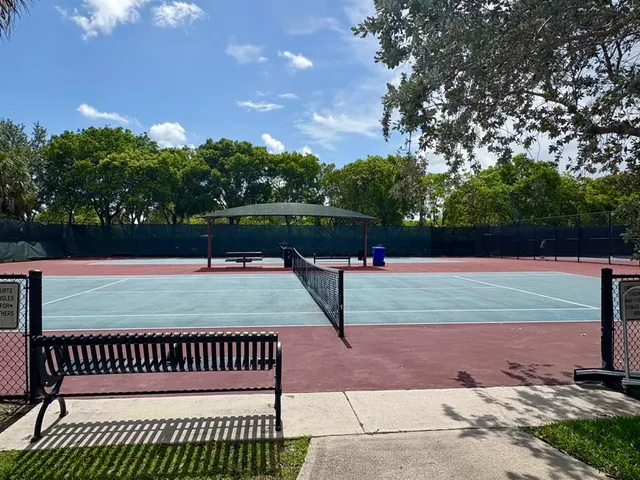 a view of a green field with a house