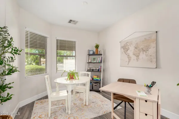 a view of a dining room with furniture window and outside view