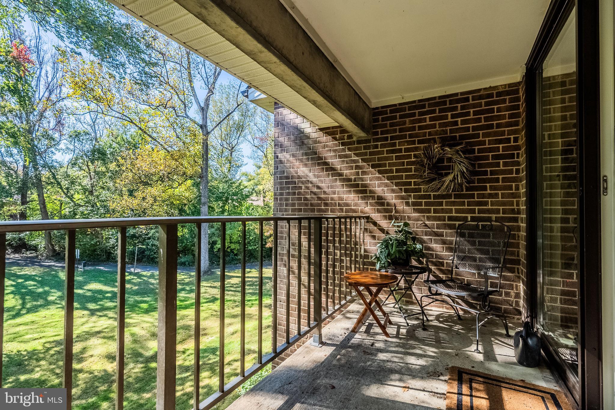 1408 Northgate Square, Unit 22B Reston, VA 20190 - Photo 20 of 23 Serene balcony with lush green views.