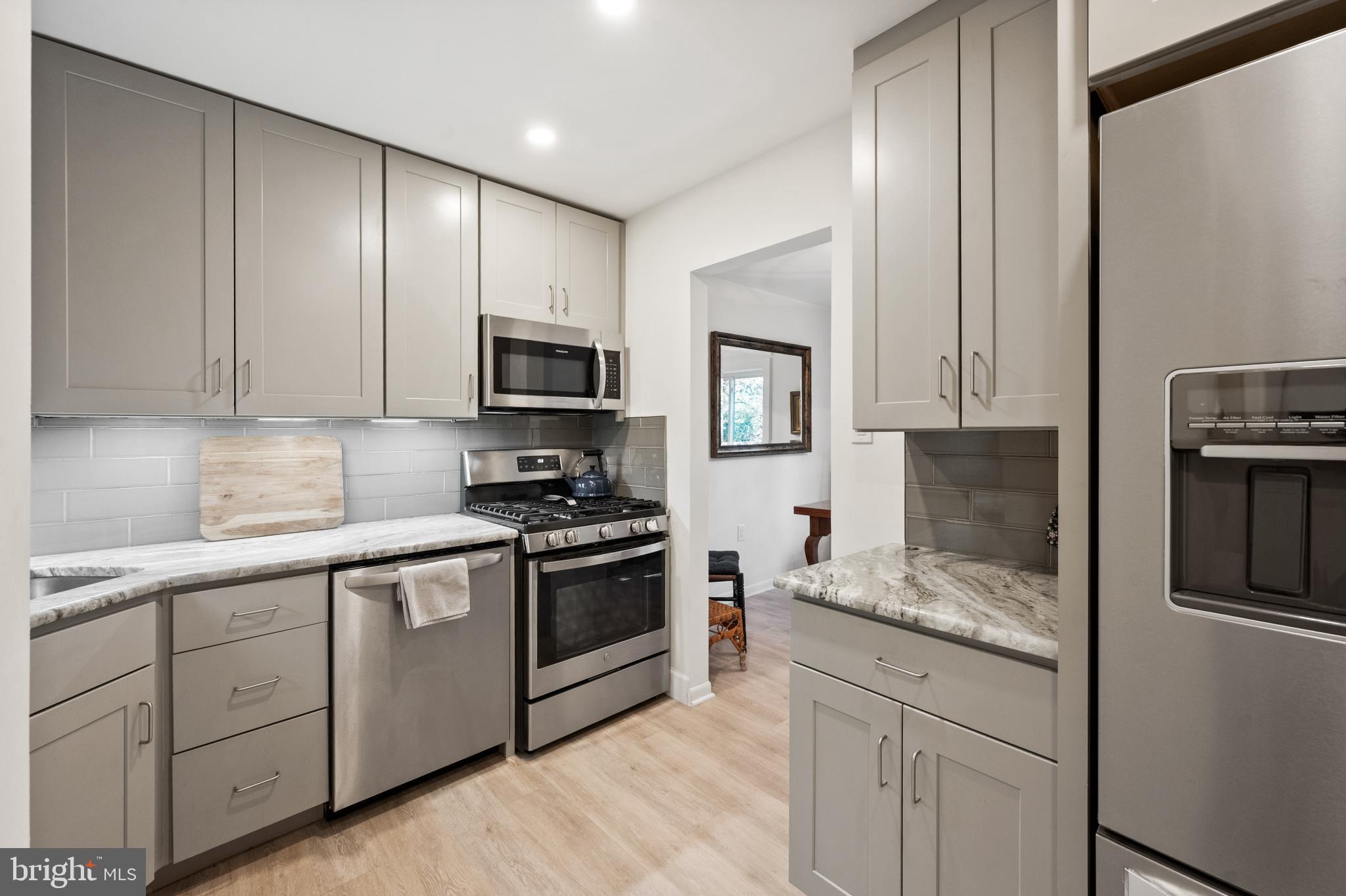 1408 Northgate Square, Unit 22B Reston, VA 20190 - Photo 2 of 23 Recently Renovated kitchen with sleek cabinetry.