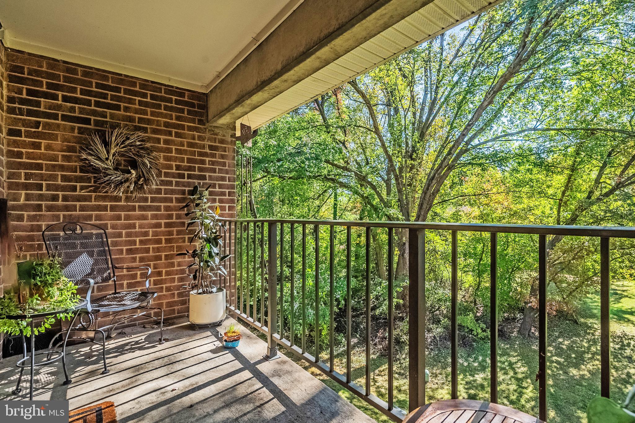 1408 Northgate Square, Unit 22B Reston, VA 20190 - Photo 21 of 23 Serene balcony with lush green views.