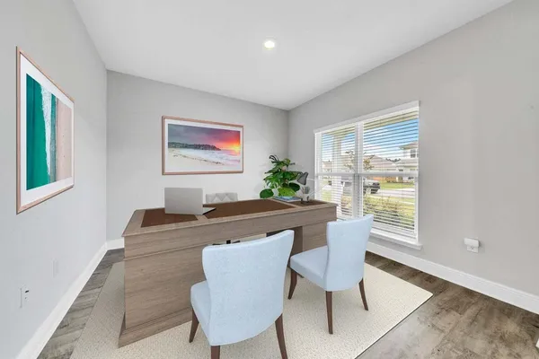 a view of a dining room with furniture window and wooden floor