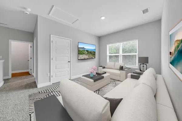 a living room with furniture and a window