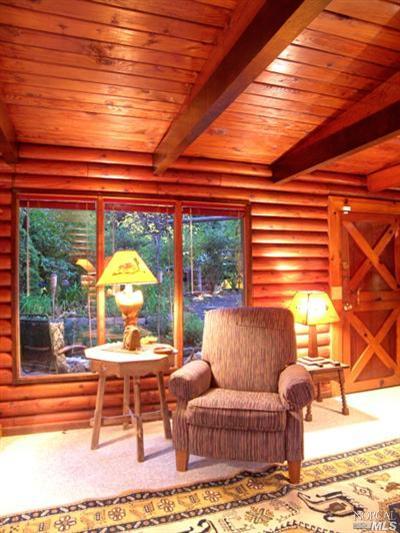 18325 Old Monte Rio Road Guerneville, CA 95446 - Photo 2 of 11 Living room window looking out to front porch.