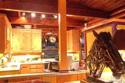 18325 Old Monte Rio Road Guerneville, CA 95446 - Photo 4 of 11 Living room view into kitchen.