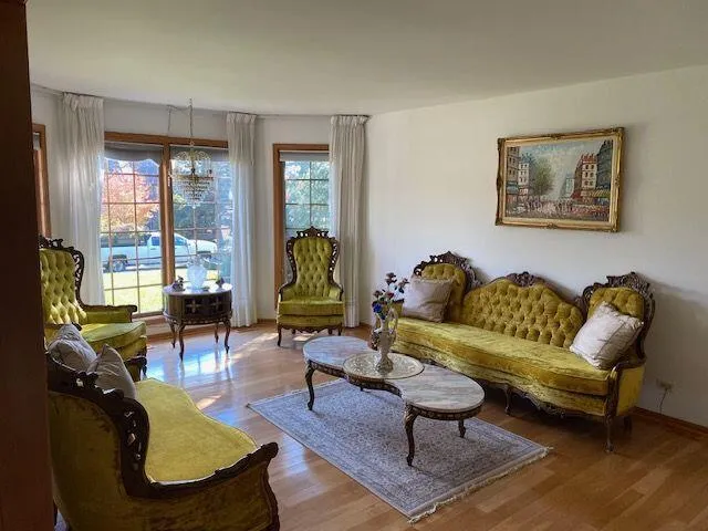 a living room with furniture rug and window