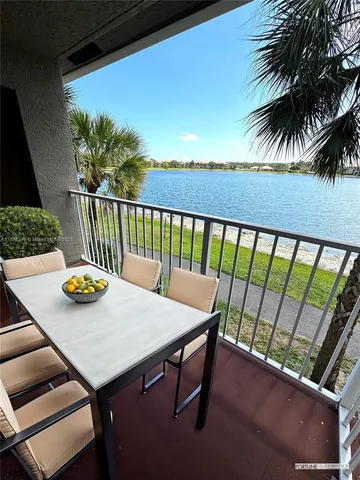 a view of a balcony with furniture