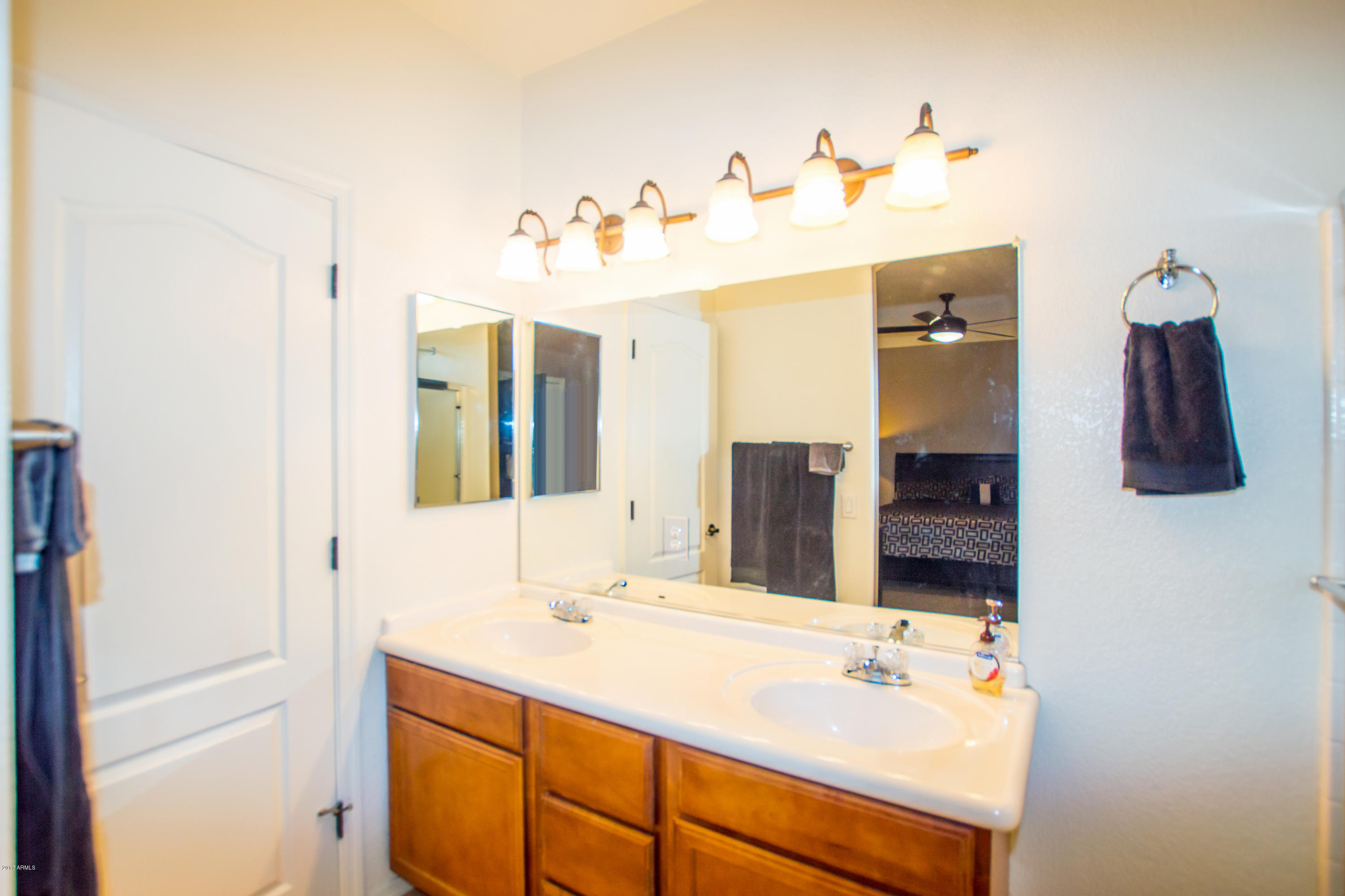 3150 East Beardsley Road, Unit 1016 Phoenix, AZ 85050 - Photo 12 of 25 a bathroom with a sink vanity and mirror