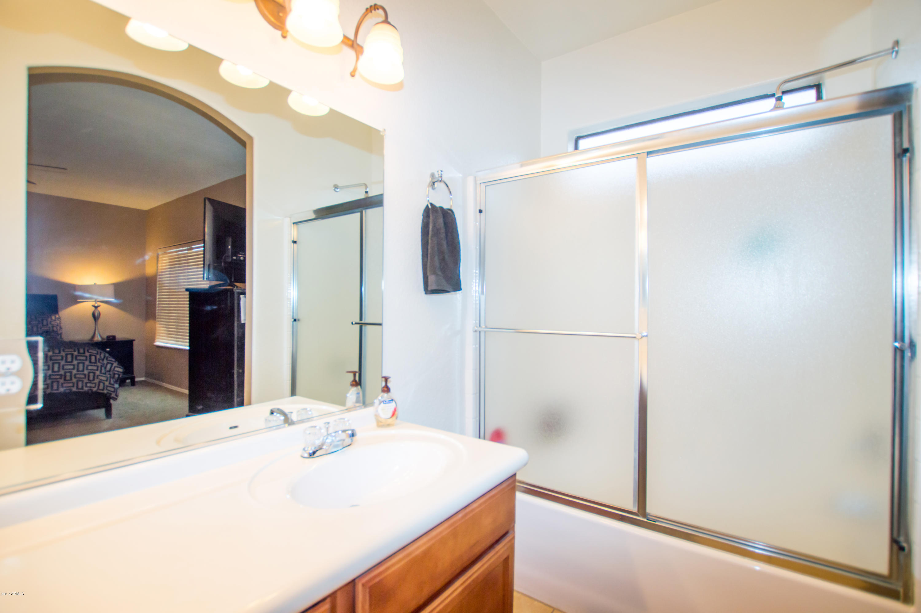 3150 East Beardsley Road, Unit 1016 Phoenix, AZ 85050 - Photo 13 of 25 a bathroom with a sink and a mirror
