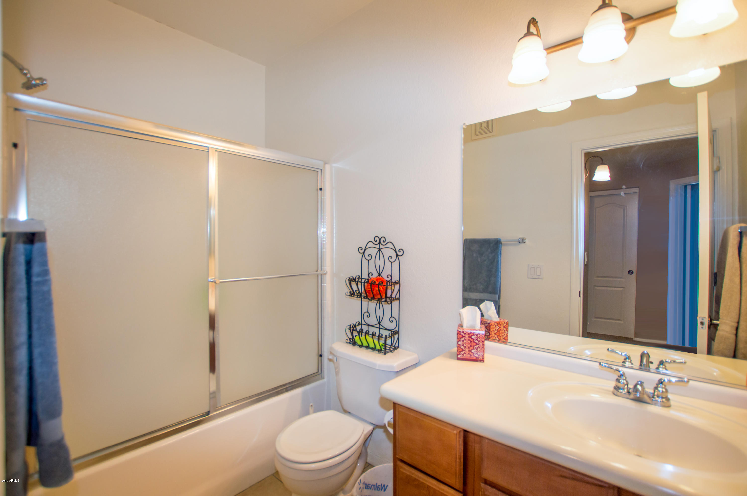 3150 East Beardsley Road, Unit 1016 Phoenix, AZ 85050 - Photo 18 of 25 a bathroom with a sink a toilet and shower