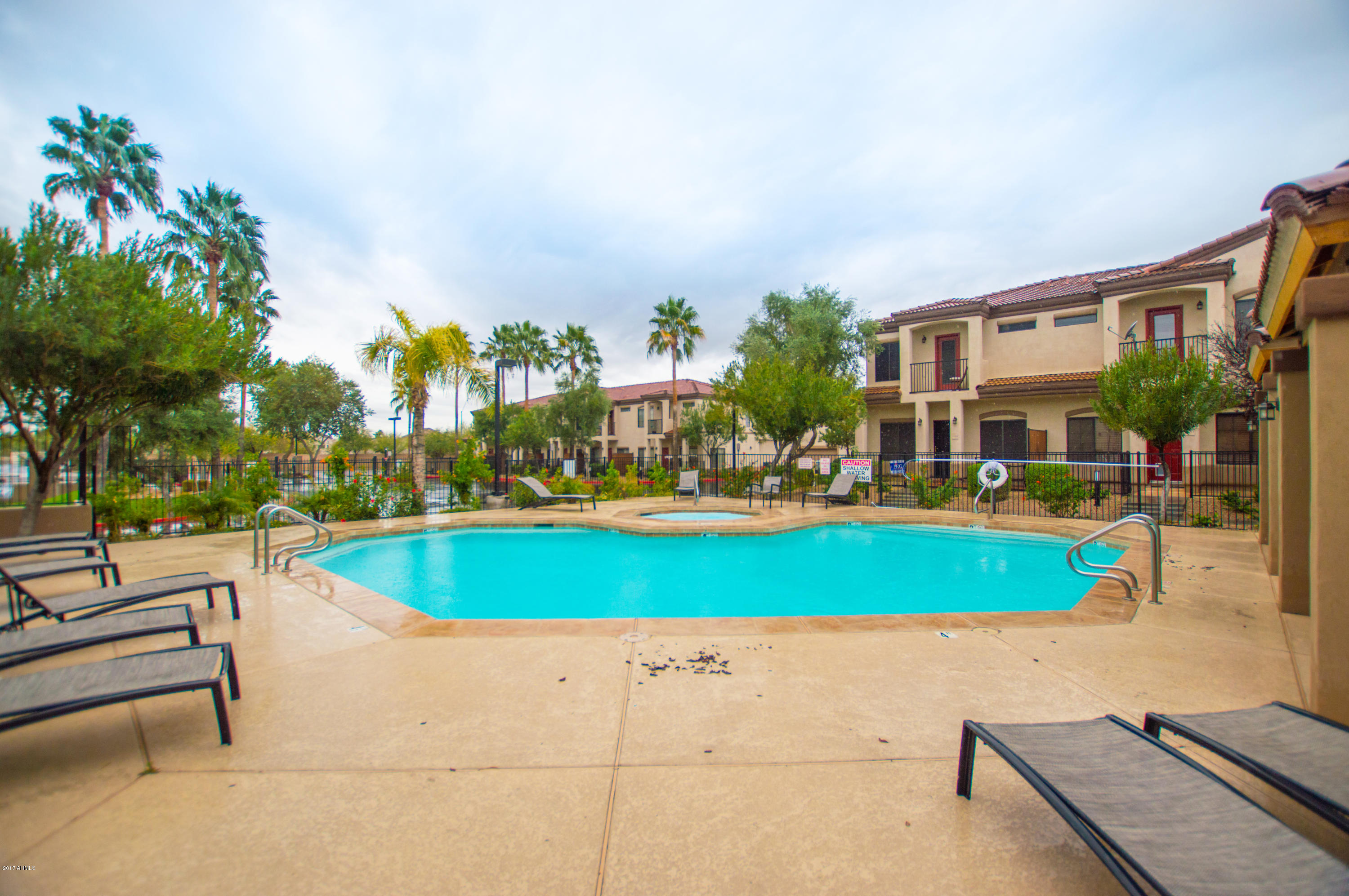3150 East Beardsley Road, Unit 1016 Phoenix, AZ 85050 - Photo 21 of 25 a view of a swimming pool with a patio