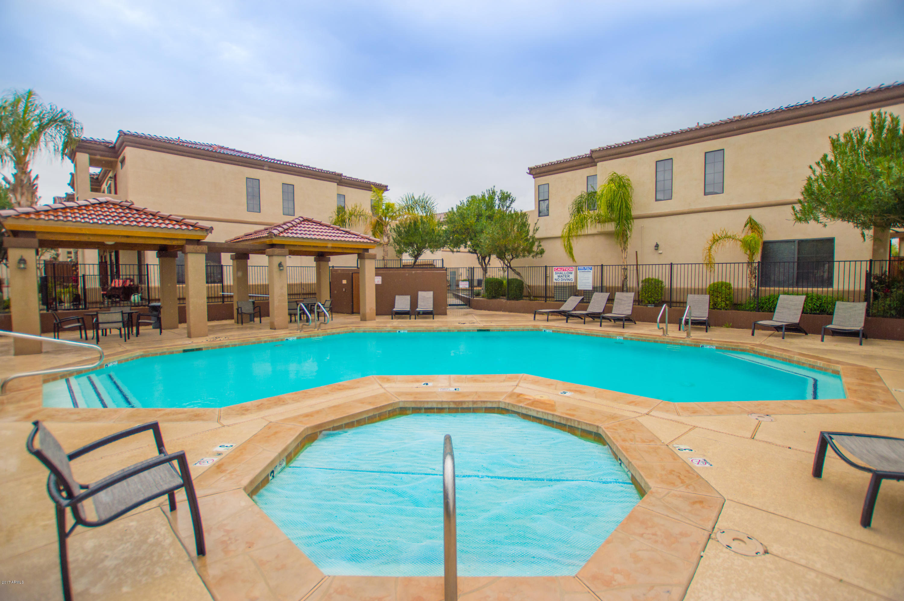 3150 East Beardsley Road, Unit 1016 Phoenix, AZ 85050 - Photo 23 of 25 a view of a house with a swimming pool