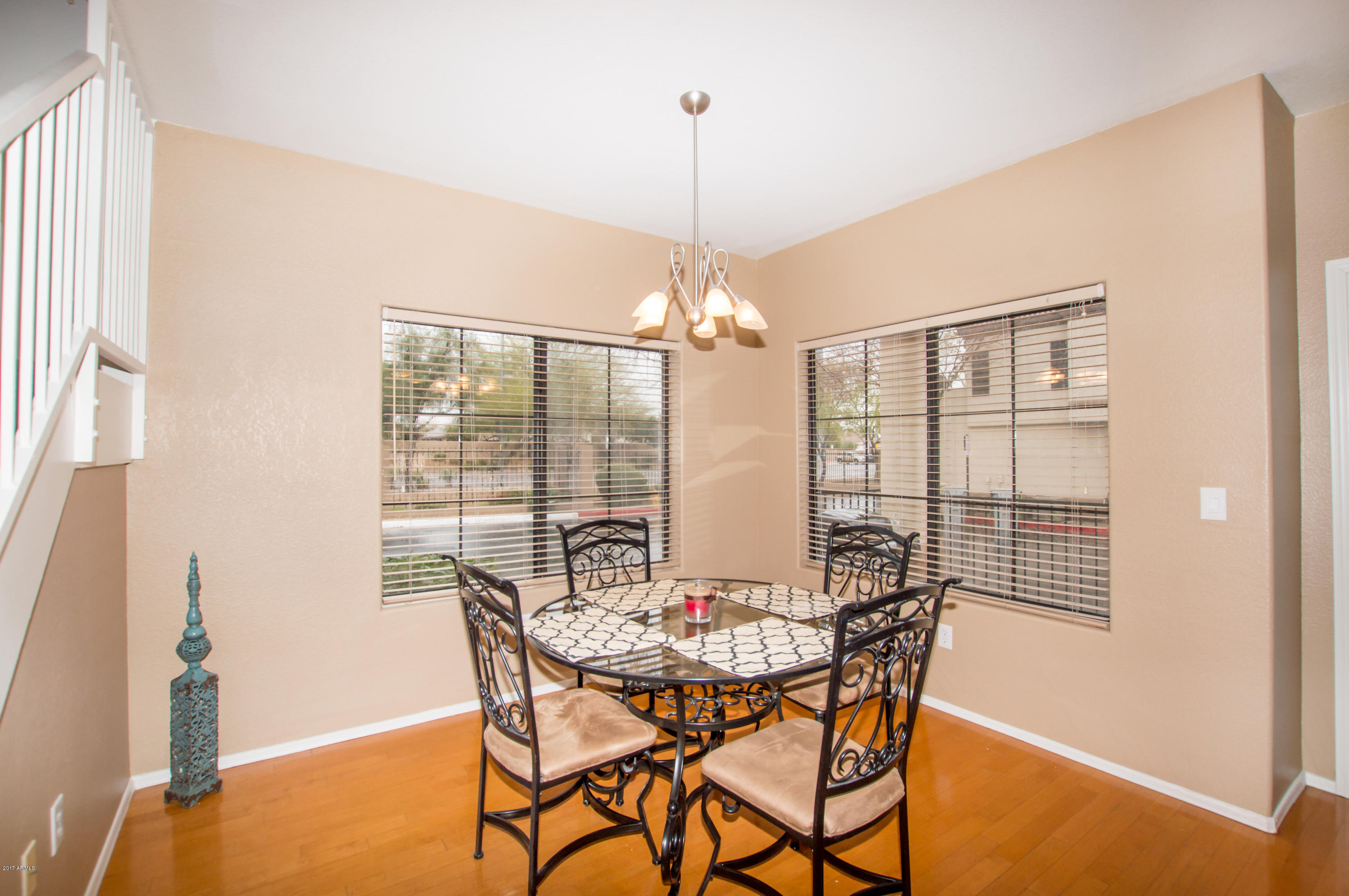3150 East Beardsley Road, Unit 1016 Phoenix, AZ 85050 - Photo 5 of 25 a dining room with furniture and window