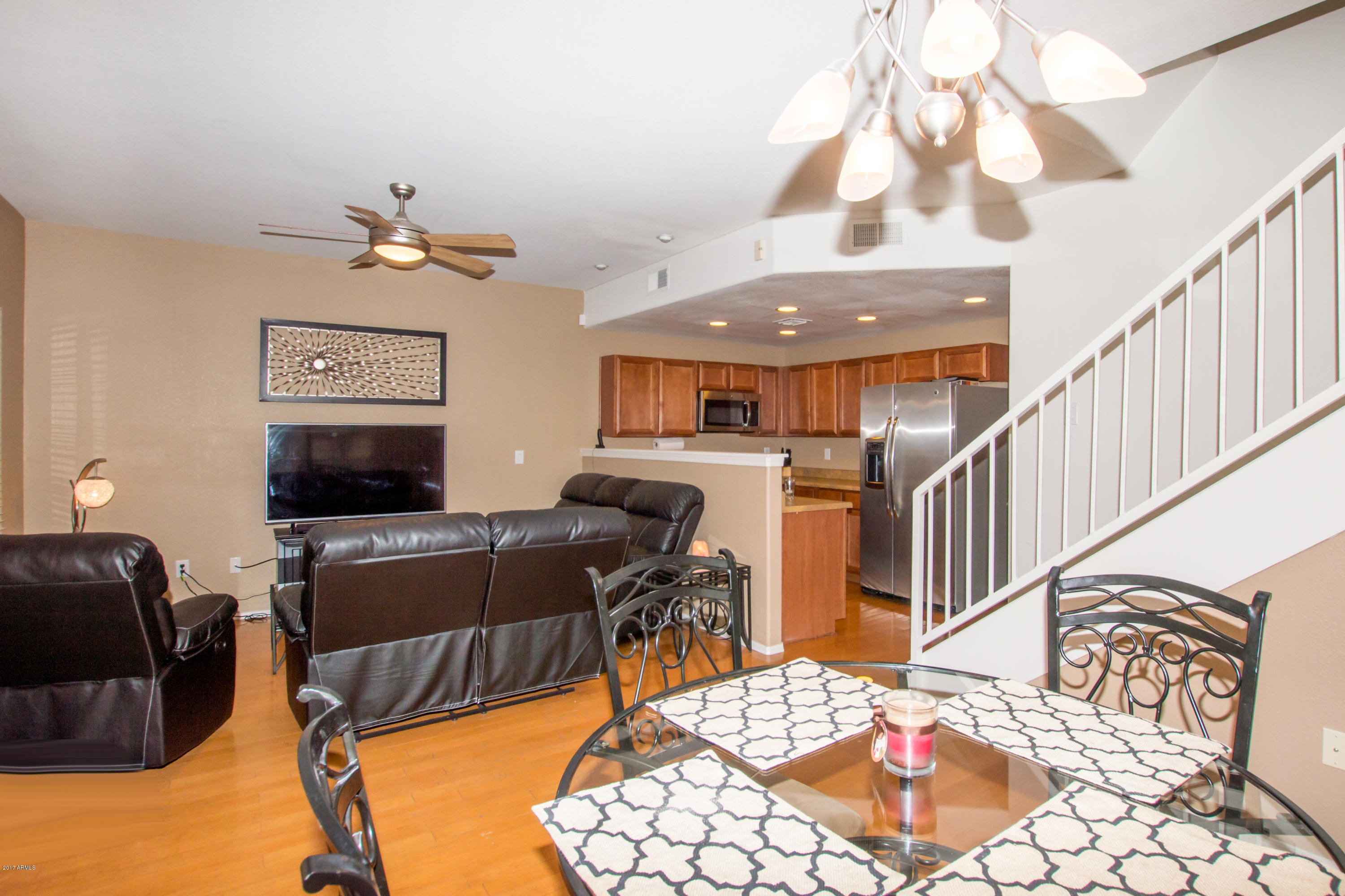 3150 East Beardsley Road, Unit 1016 Phoenix, AZ 85050 - Photo 6 of 25 a living room with furniture and a flat screen tv