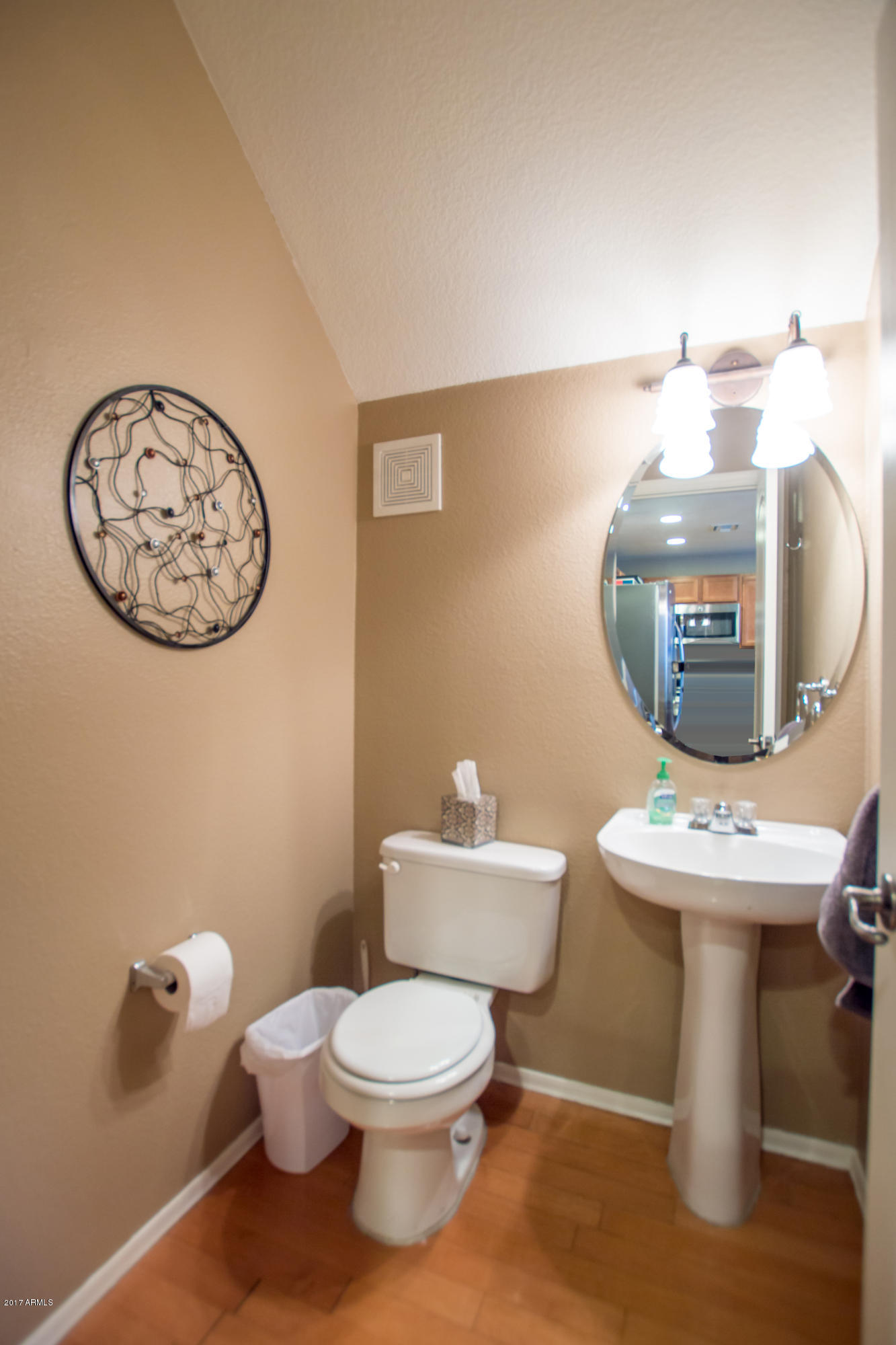 3150 East Beardsley Road, Unit 1016 Phoenix, AZ 85050 - Photo 8 of 25 a bathroom with a toilet a sink and mirror